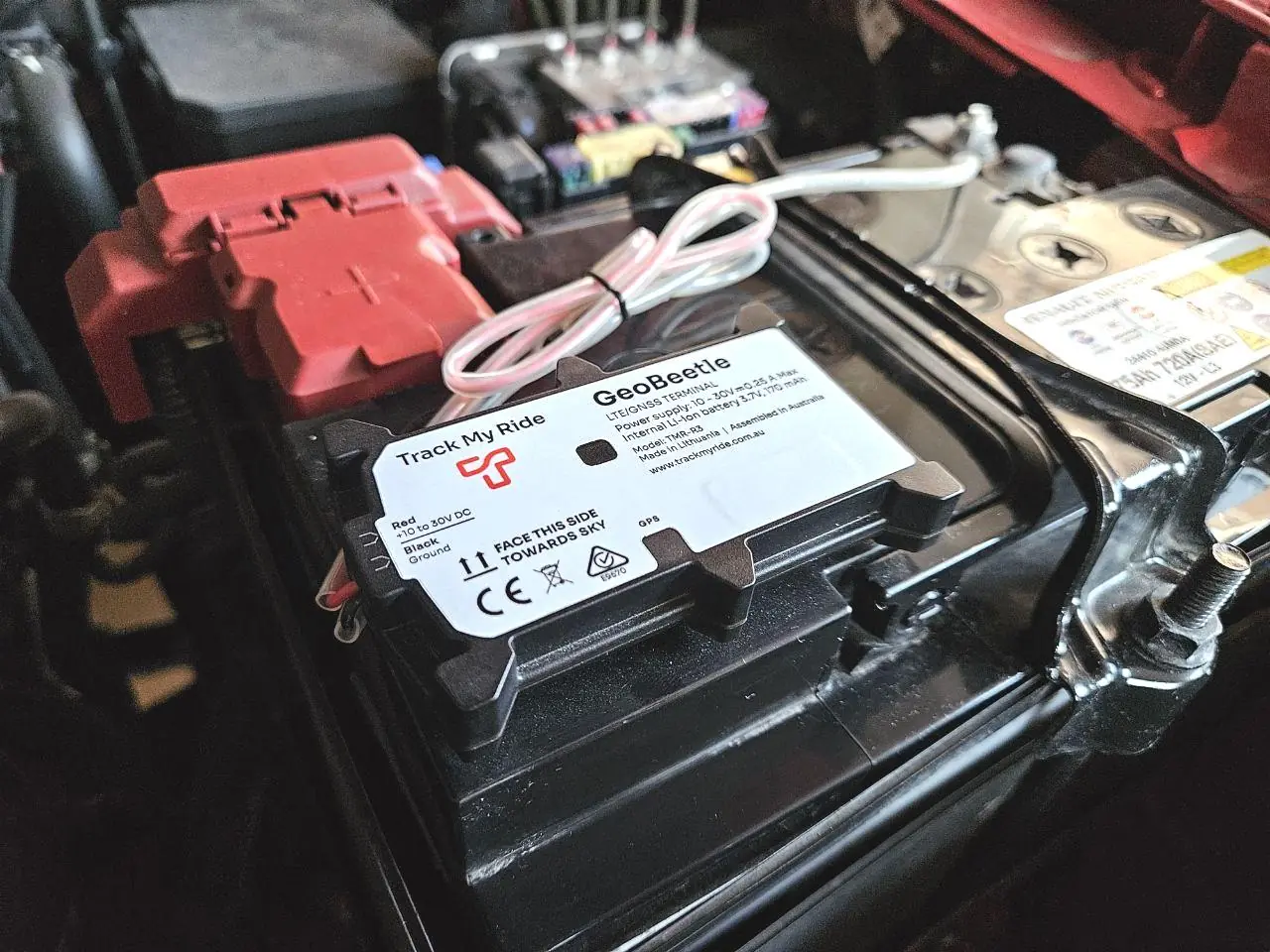 GeoBeetle mounted on vehicle battery